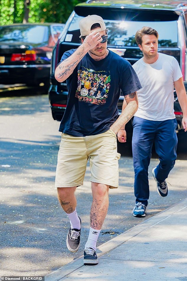 Brooklyn was flanked by his pal Jeremy