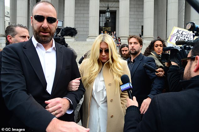 The American producer worked with Perry after settling a legal dispute with Kesha (pictured) who he sued in 2014 when she accused him of physical, sexual, and emotional abuse