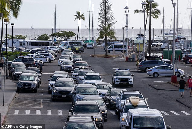 Videos posted by people at the scene show gridlocked traffic jams as others claimed there are 'thousands' trying to leave low lying areas (Ala Way Harbour, Waikiki)