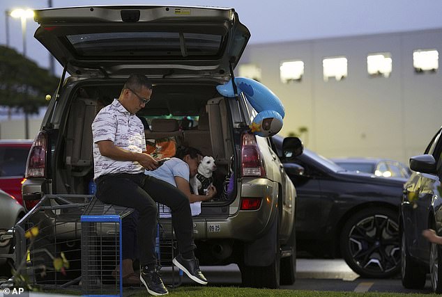 Oahu residents seek refuge from the threat of tsunami in a Walmart parking lot in Kapolei, Oahu, Hawaii, Tuesday, July 29, 2025