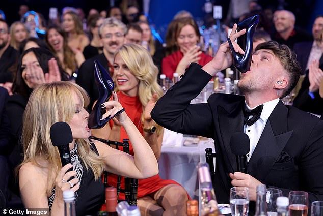 During last year's BRIT Awards, Roman left viewers cringing when he talked Kylie Minogue into doing a 'shoey' - an Aussie tradition which involves drinking out of a shoe