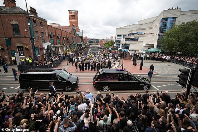 Ozzy's funeral cortege stopped at the 'Black Sabbath Bridge' off Birmingham's Broad Street to view the tributes, watched by thousands