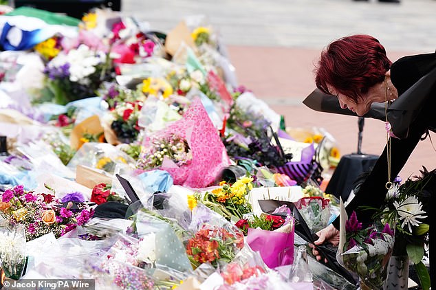 Sharon laid a single flower, as did her children, at the head of the sea of tributes left to Ozzy