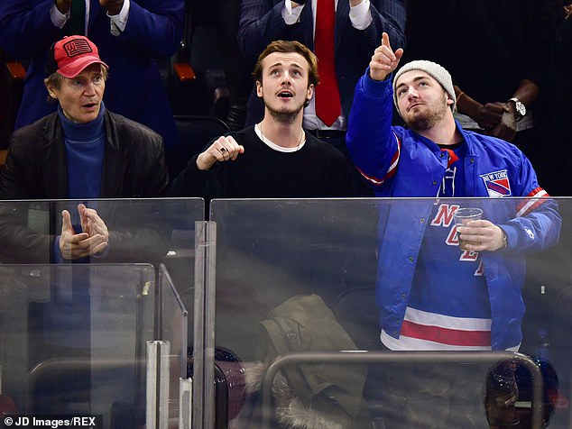Liam pictured with his sons Michael and Daniel at a Rangers NHL ice hockey game in New York in 2019