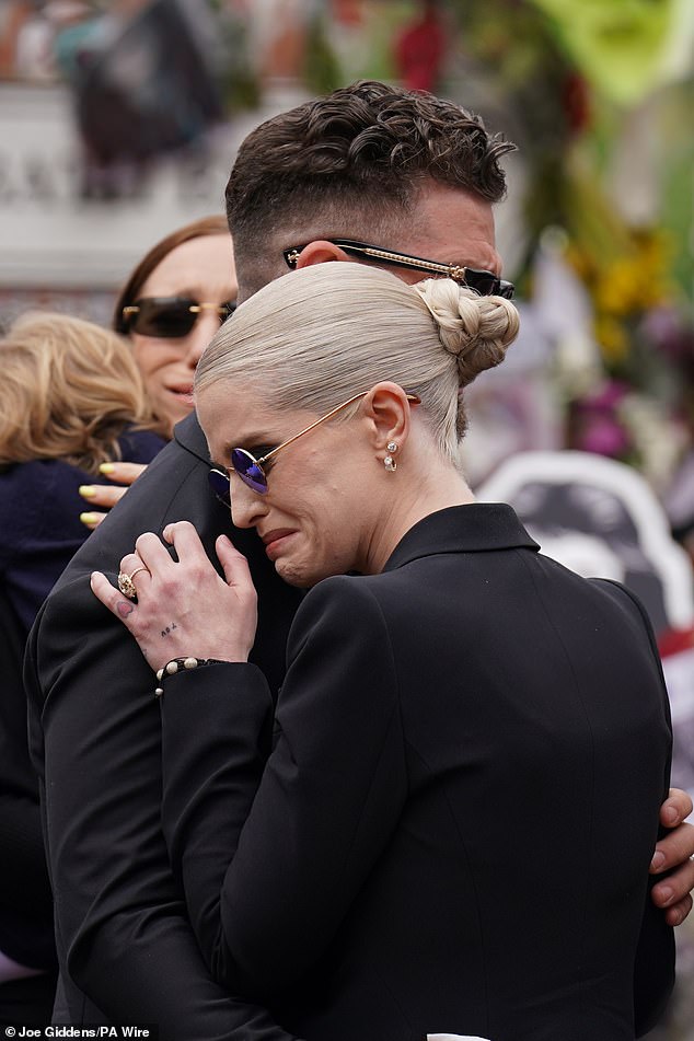 Kelly Osbourne shared an embrace with her brother Jack at the Black Sabbath Bridge tribute