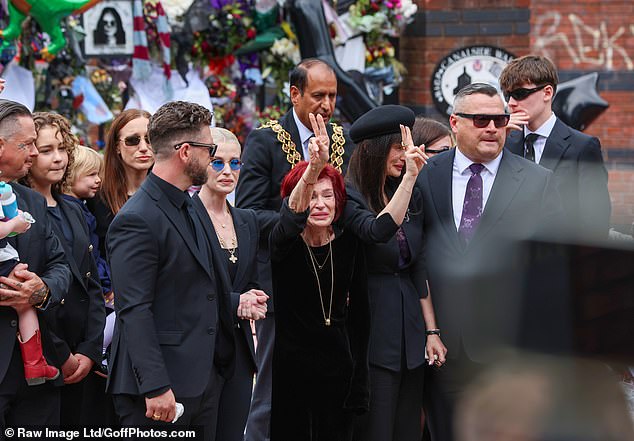 Sharon gave a peace sign towards Ozzy Osbourne fans turning out in Birmingham
