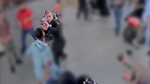 Officers were left cowering and attempting to protect themselves as the savage attack unfolded