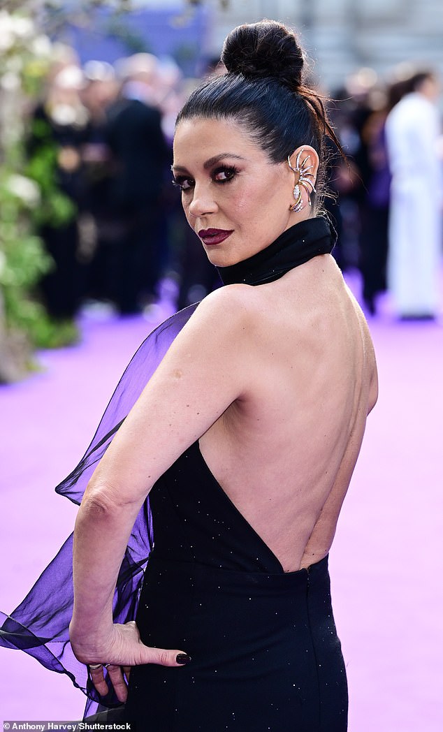 She teamed the ruffled number with a pair of sheer heels, pulled her hair up into a bun and topped off her look with dark makeup