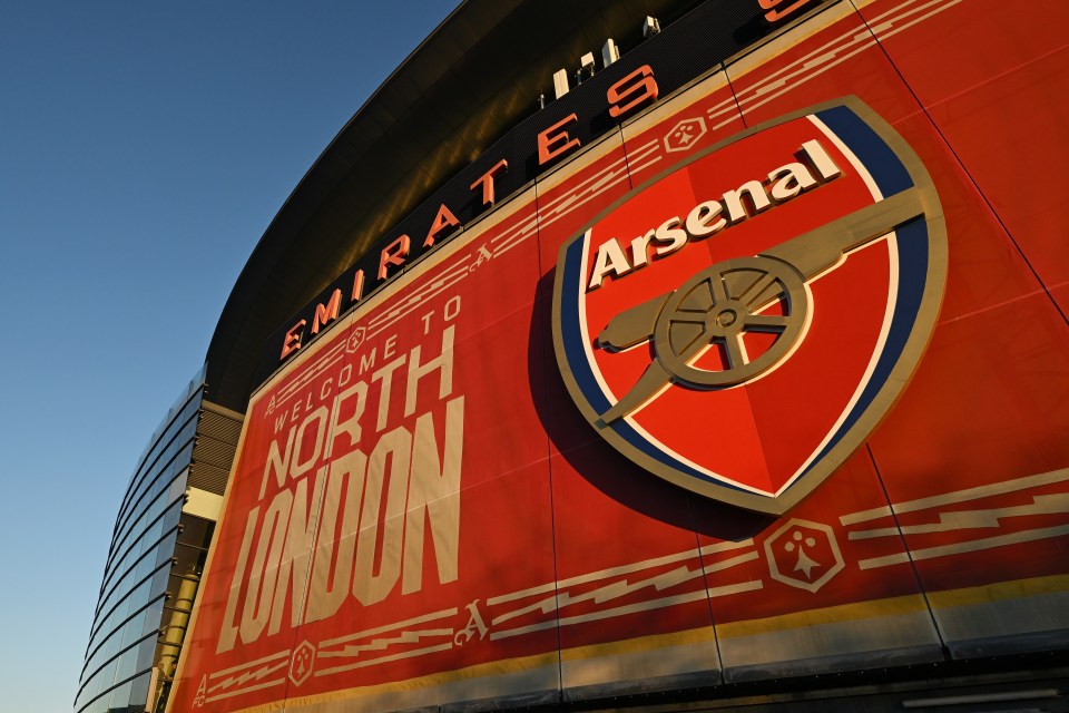 Arsenal FC emblem and "Welcome to North London" banner on the Emirates Stadium.