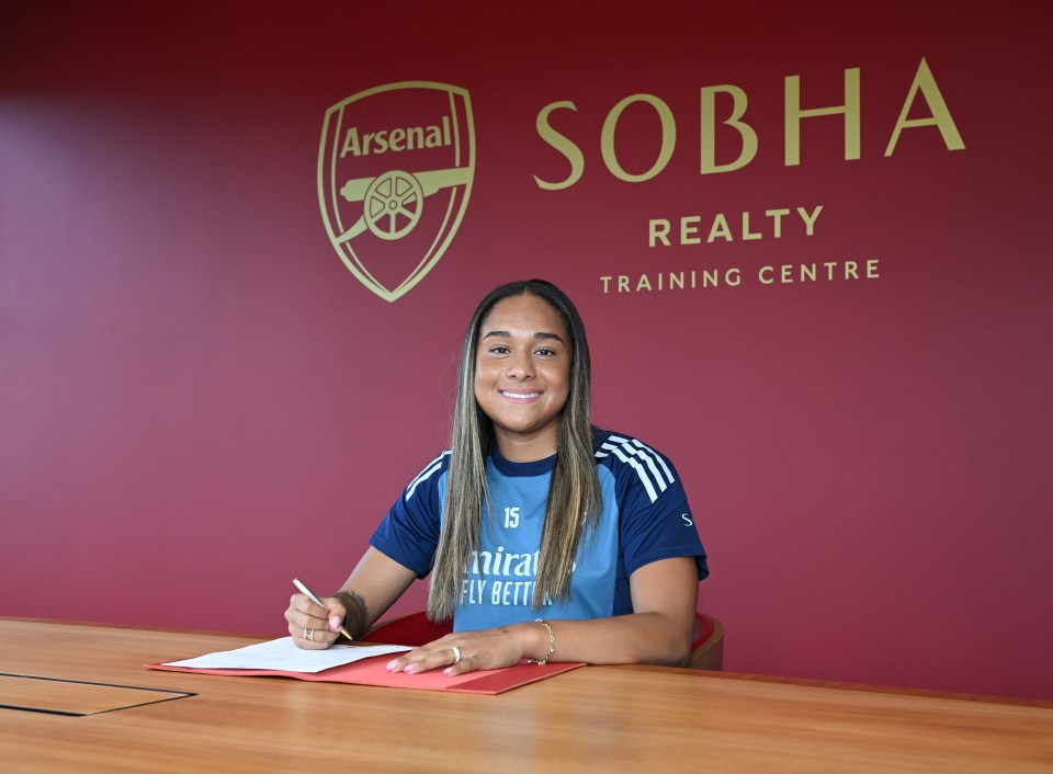 Olivia Smith signing for Arsenal at the Sobha Realty Training Centre.
