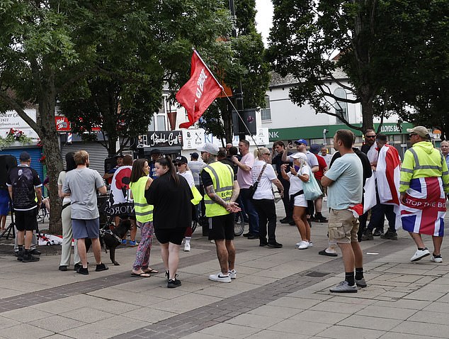 Protestors gather in Waterlooville high street protesting against migrant housing in the town centre