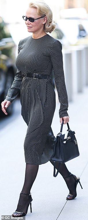 She had on a black-and-white dress on Wednesday