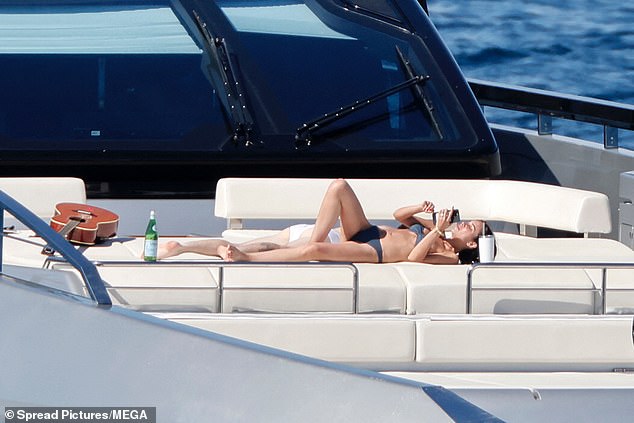 Jackie showed off her model figure in a skimpy bikini