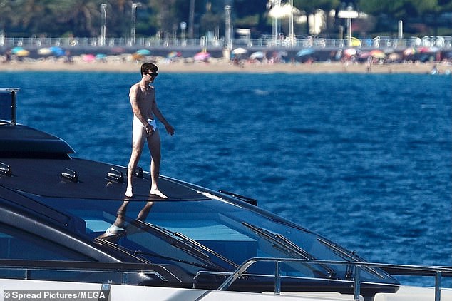 Cruz stood proudly on the front of the boat