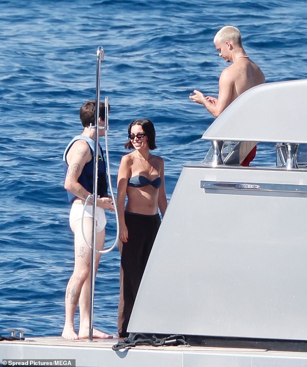 The two brothers chatted away on the boat with Cruz's girlfriend Jackie