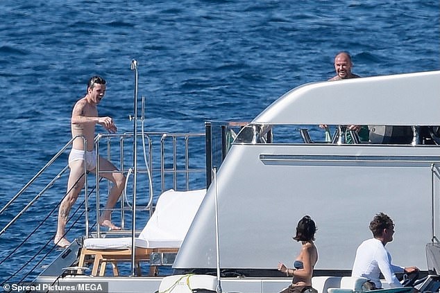 David popped up from behind the side of the boat