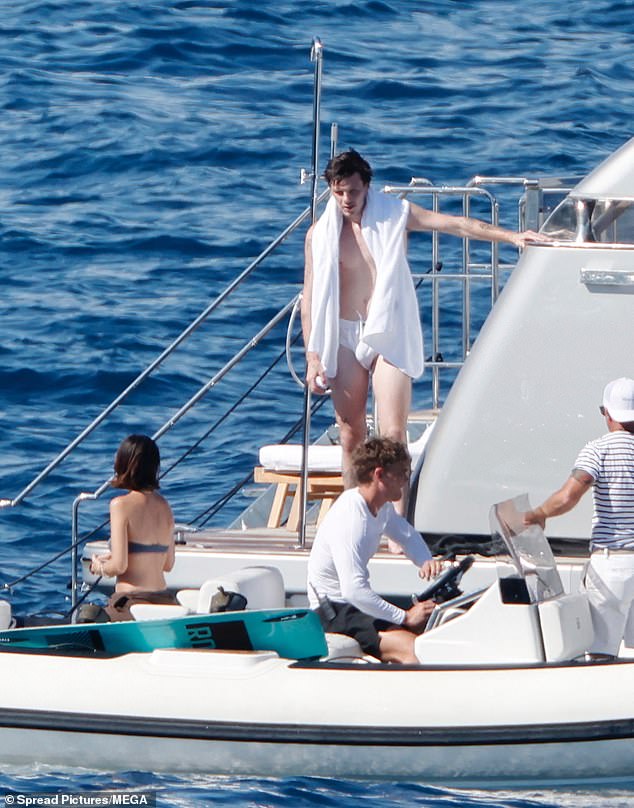He dried off with a white fluffy towel