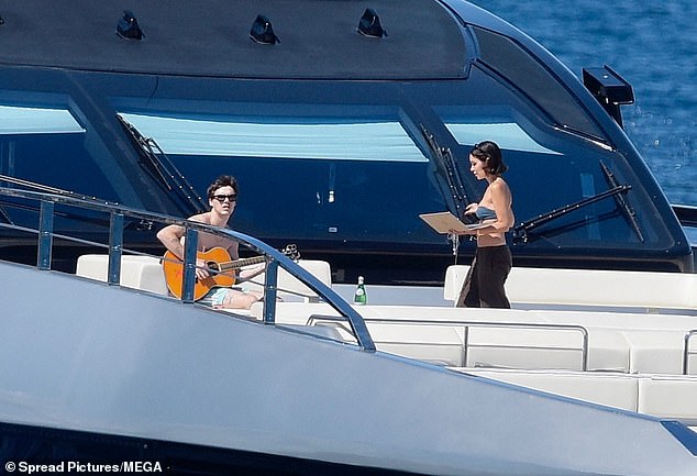 Cruz, who plans to be a musician, was seen practicing on holiday