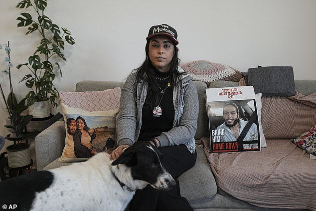 Released hostage Ilana Gritzewsky with photos of her boyfriend, Matan Zangauker, who is being held hostage by Hamas in the Gaza Strip