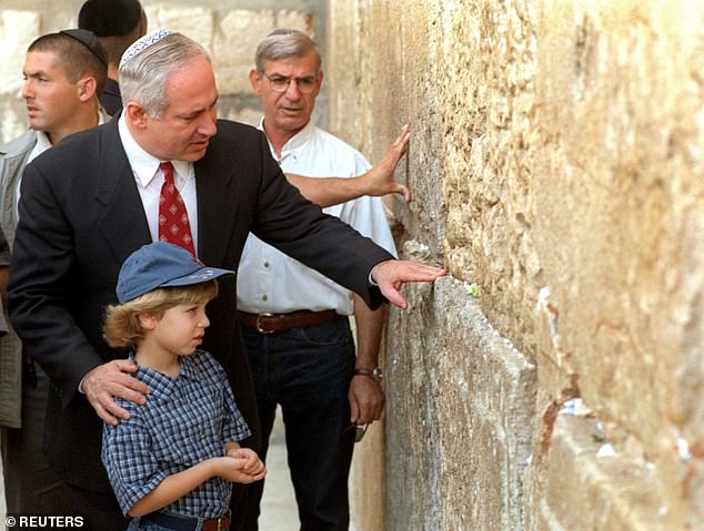 Israeli Prime Minister Benjamin Netanyahu at the Wailing Wall in East Jerusalem, with his then-seven-year-old son Yair (now 34), which houses the Old City