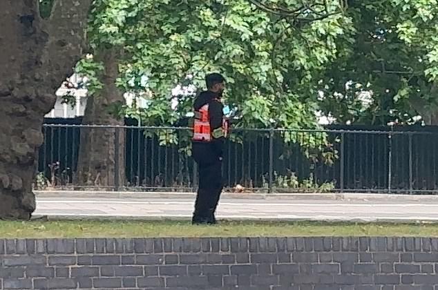 A security guard patrolling the spot, which has been used to pitch tents for years