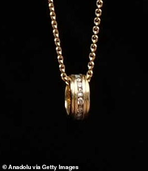 Sharon was seen wearing a gold ring featuring a row of diamonds around her neck on a chain