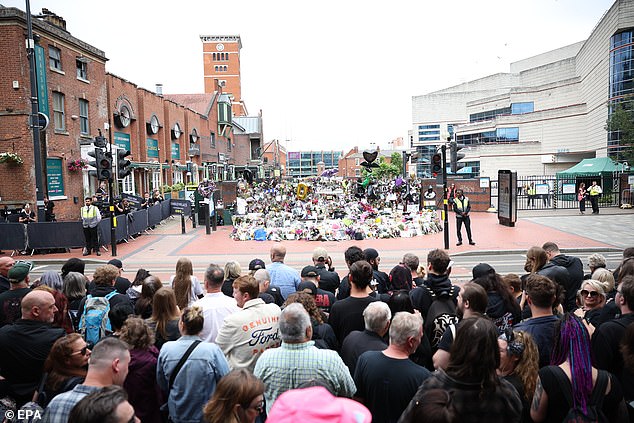 Fans clapped and cheered chanting 'Ozzy, Ozzy, Ozzy' as the rock legend's hearse passed through the streets of Birmingham as Sharon watched on and brushed away tears