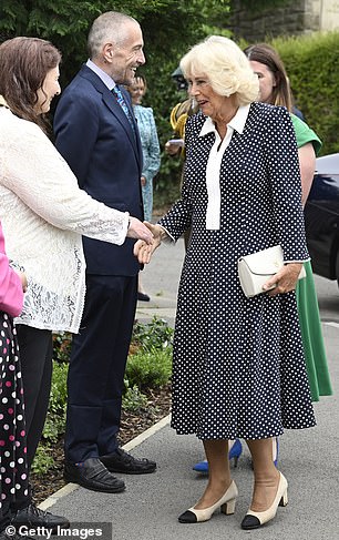 Camilla carries a Launer bag to officially open Ratho Library in Newbridge in July