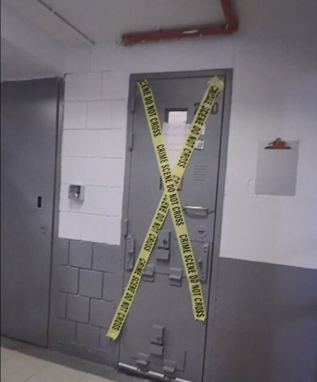 Crime scene tape across a door.
