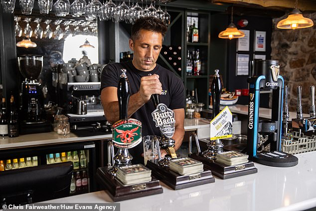 Henson at the bar in his new venture, The Fox, in St Brides Major in the Vale of Glamorgan