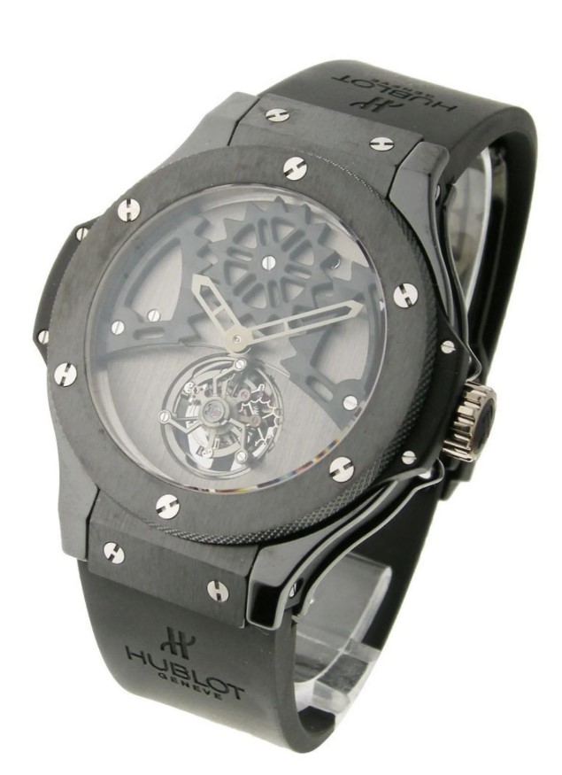 Hublot Big Bang watch with black strap and skeletonized movement.