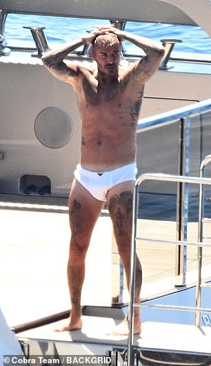 He appeared to have borrowed the look from his father David, who has been spotted wearing a strikingly similar pair on other holidays as recently as last year (David pictured last August)