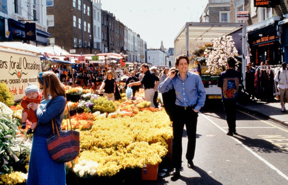 Hugh Grant at a flower market.