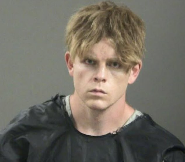 A chilling new mugshot was released of James Andrew McGann (pictured), the 28-year-old elementary school teacher accused of brutally executing a husband and wife