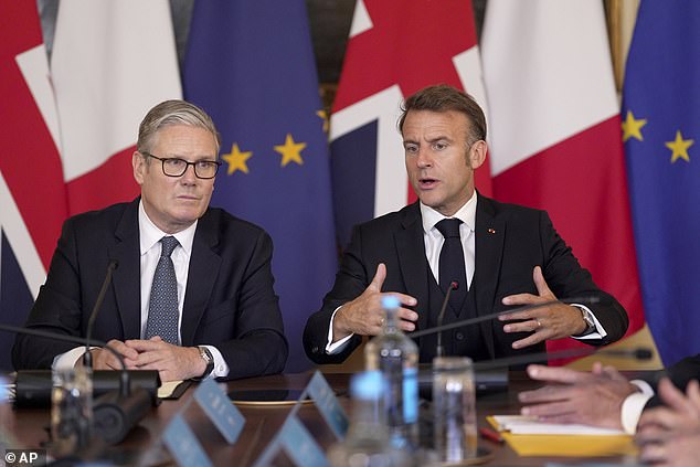 Britain's Prime Minister Keir Starmer, left, and French President Emmanuel Macron attend a plenary at the UK-France Summit in Downing Street, London Thursday, July 10, 2025