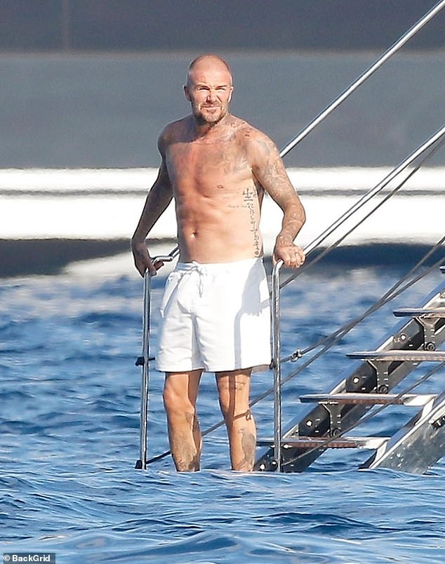 But David opted not to once again sport the recognisable look as he instead stepped out in a pair of more modest white board shorts on his luxury yacht