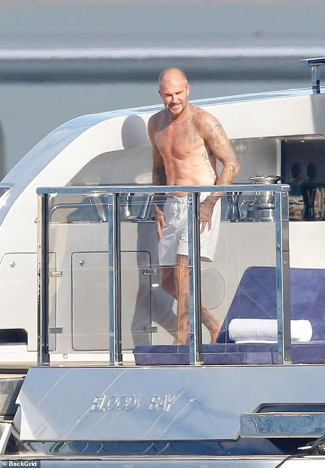 His look was worlds away from his skimpy underwear as he ditched the look in favour of board shorts