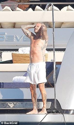 He then used the outdoor shower before relaxing on the back of the boat as he enjoyed his summer voyage