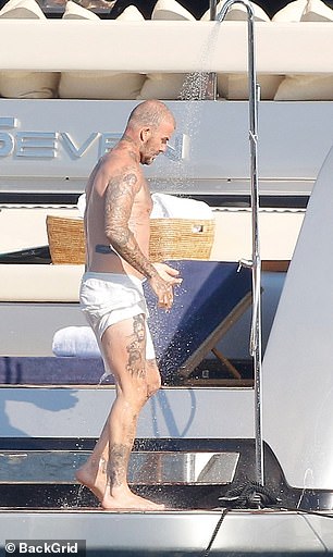 David showed off his intricate tattoos during the shower