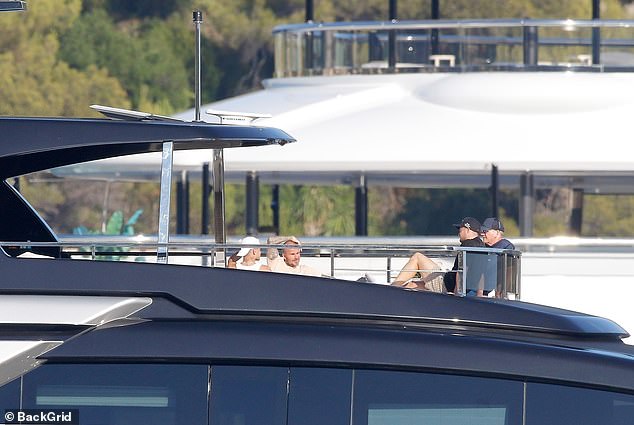 The families also relaxed on top of the boat in the sunshine as they made the most of the weather