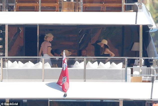 The families enjoyed a lavish food spread on the back of the yacht as they soaked up the sunshine