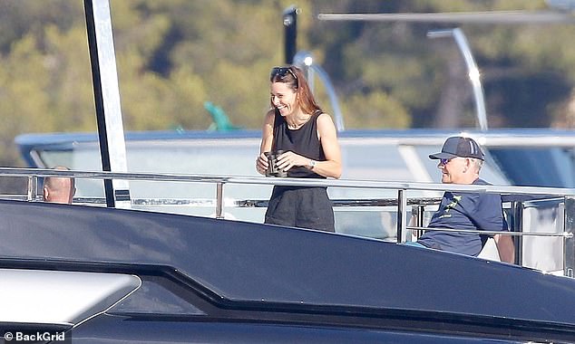 Tana appeared to be in excellent spirits as she flashed a huge smile while using some binoculars to sightsee