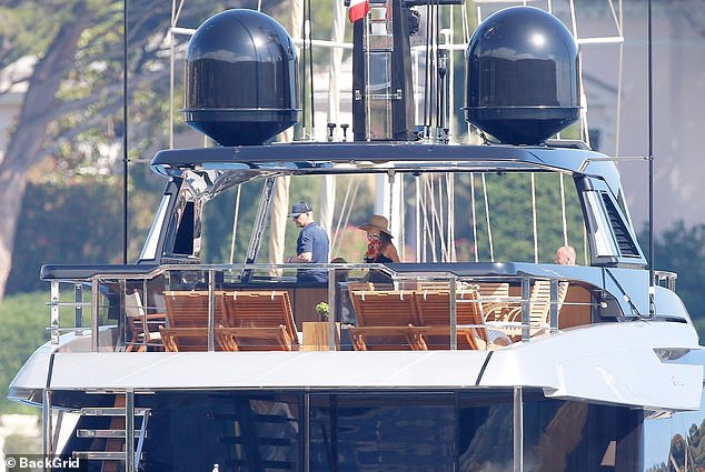 Gordon kept it casual in a navy T-shirt and a black cap as he enjoyed a trip on the Beckham's £16million yacht, called Seven - after David's football number