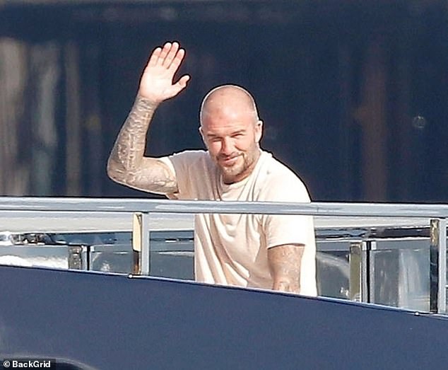 David appeared to be in excellent form as he smiled and flashed a wave during the day out