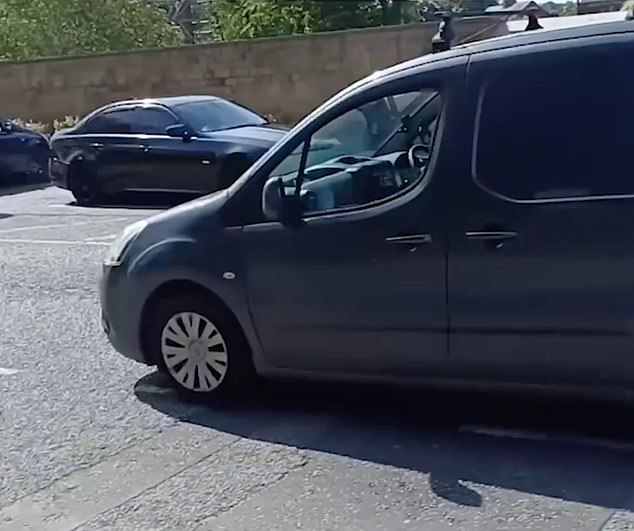 The squeal of tires and brakes could be heard as the car raced down the busy street lined with parked cars and moving traffic towards a man dressed in pink shorts
