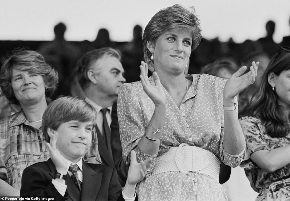 Princess Diana and her eldest son Prince William clap as they watch the women's final at Wimbledon in 1991