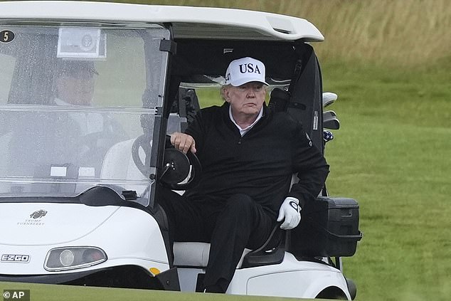 US President Donald Trump blasted music as he drove his golf buggy round the course