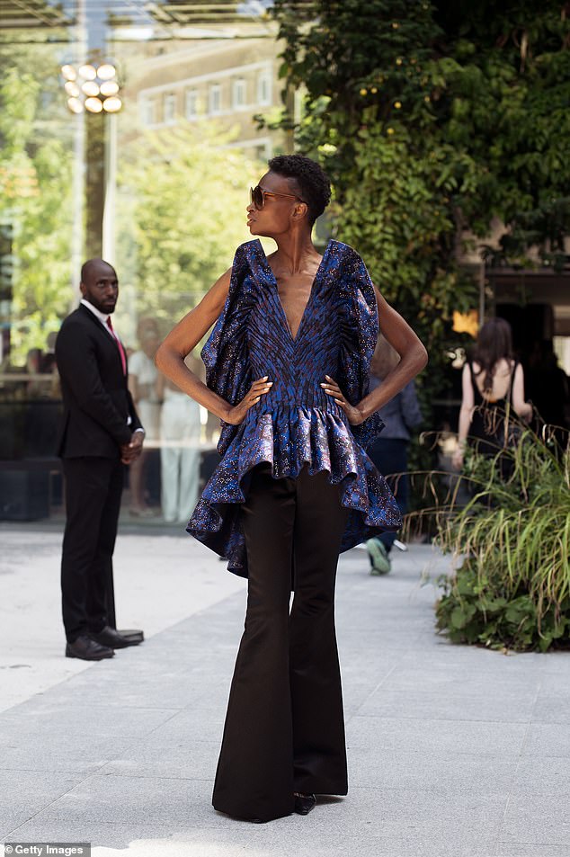 A guest wears outside Ardazaei show during the Haute Couture Fall/Winter 2025/2026 as part of Paris Fashion Week on July 10, 2025