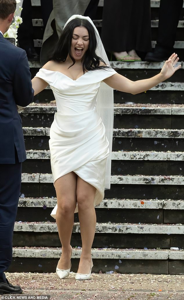 She tied the knot with The 1975's George Daniel on Saturday - but the star of the show was Charli XCX's chic Vivienne Westwood mini-dress that she wore for the occasion