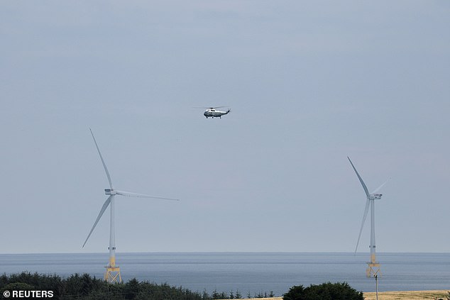 Wind turbines pictured below Marine One, carrying U.S. President Donald Trump, towards Trump International Golf in Aberdeen on Monday. He branded wind turbines 'ugly monsters'